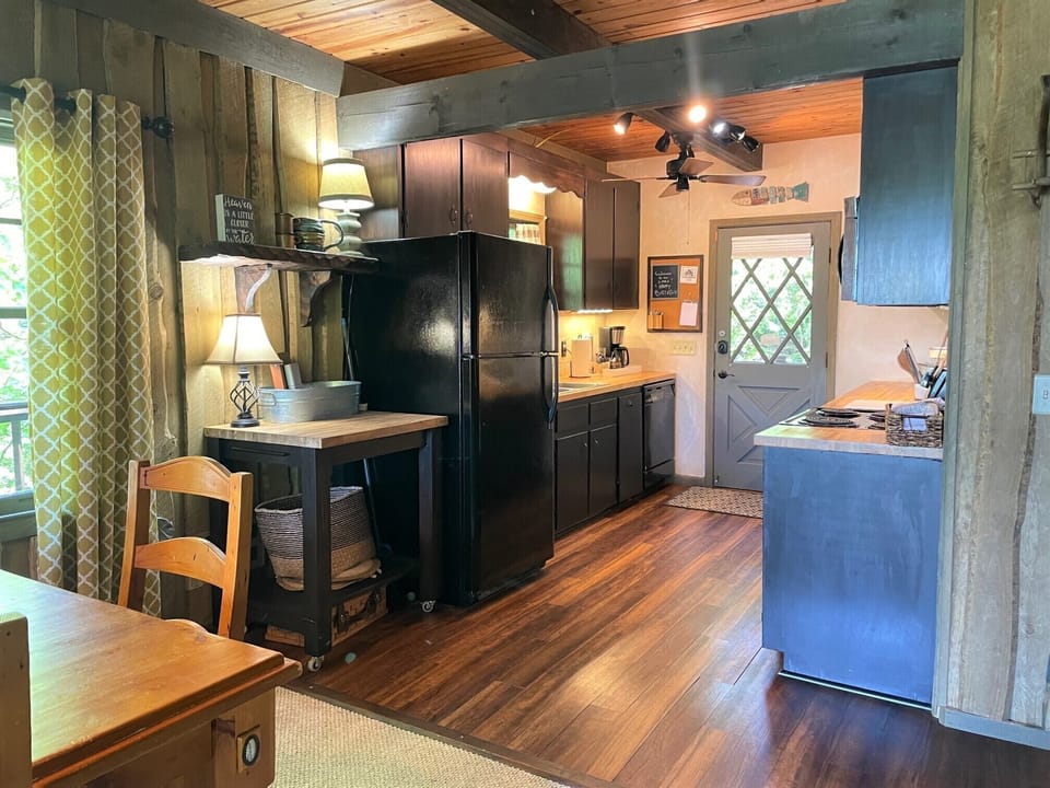A well-stocked kitchen with tons of cooking supplies & storage space.  