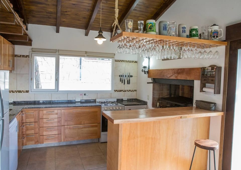 Fully equipped kitchen with indoor BBQ and bar counter