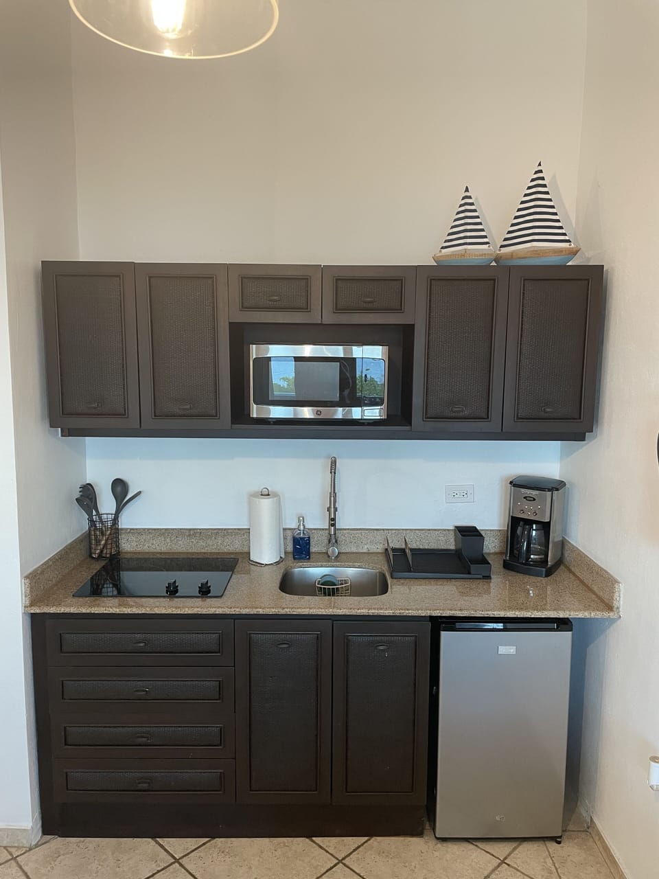 Kitchen w/ microwave/fridge/cooktop/dishes/pots & pans/coffee maker/toaster etc.