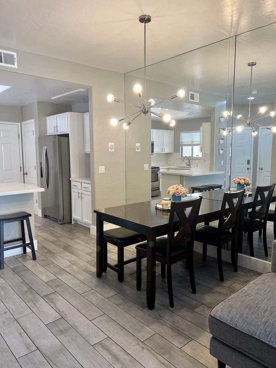 Dining area right off of the kitchen comfortably fits 4