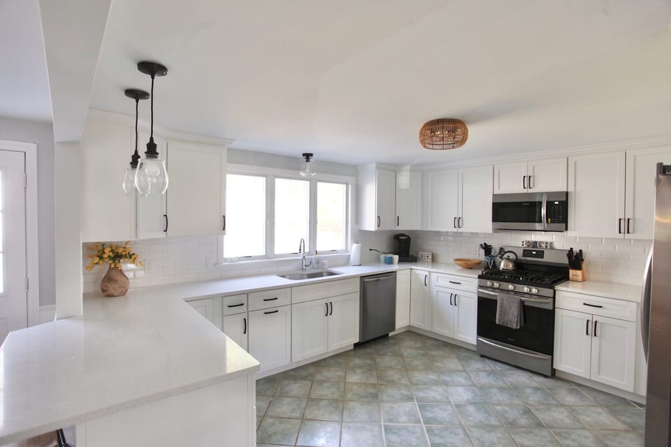 Newly renovated kitchen with all new appliances and breakfast bar