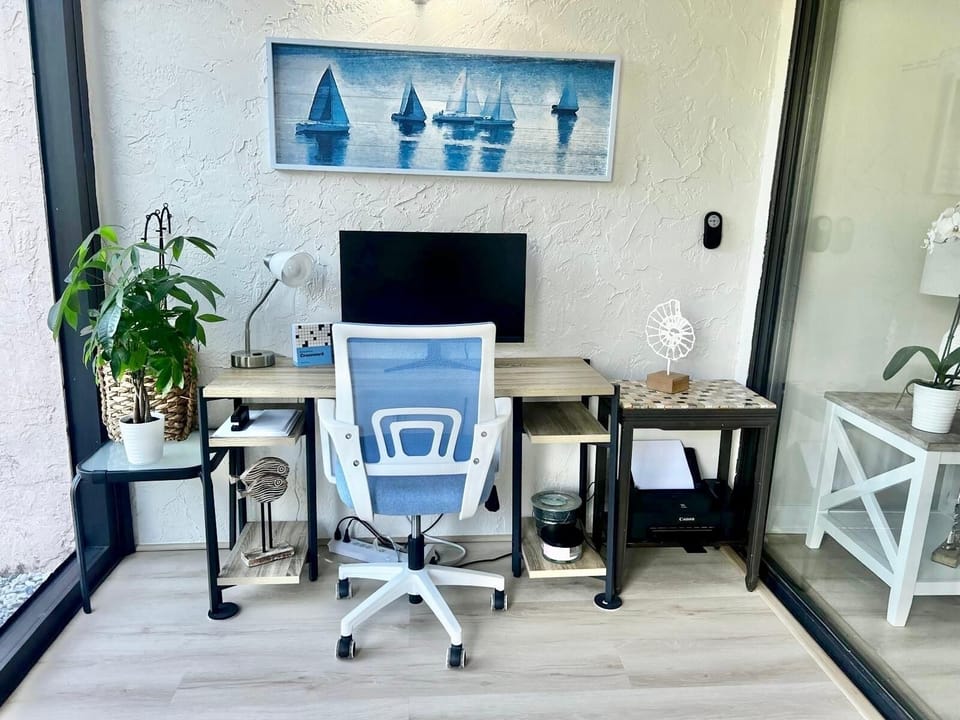 Office space with monitor and printer.