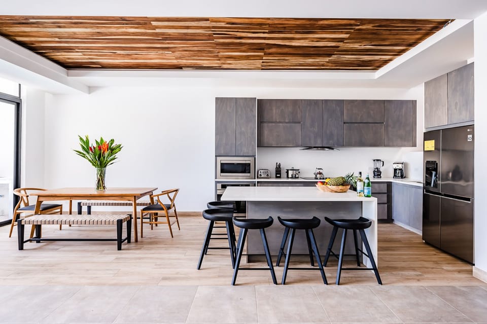 Casa Isabella kitchen island and one of the two dining tables 