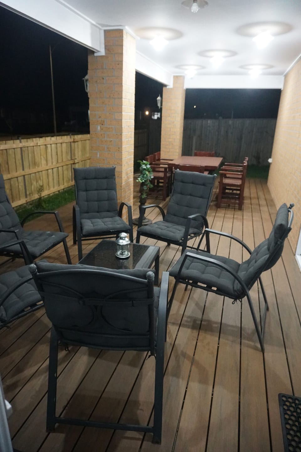 Covered Alfrsco with comfy chairs and Timber Dining Table with view