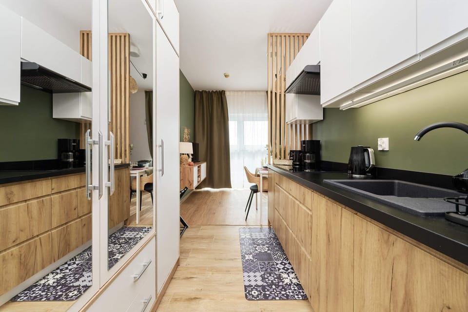 The kitchen area is fully equipped with all necessary appliances and utensils. 