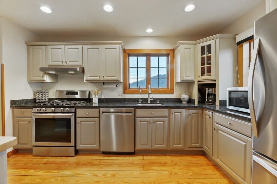House 1 Kitchen with stainless appliances and mountain views
