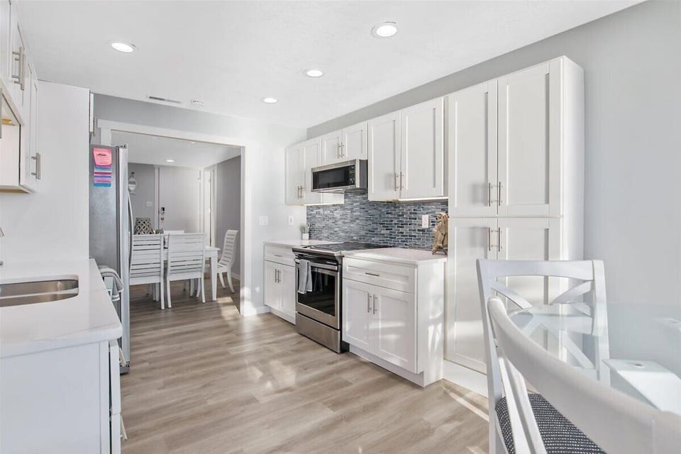 View from kitchen into the dining area and Entry.
