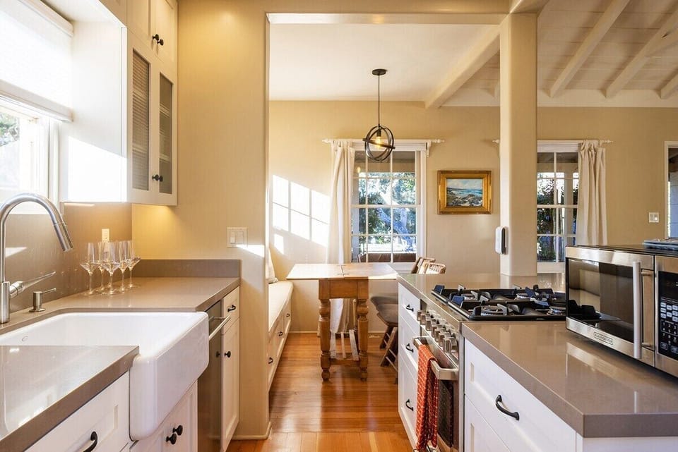 View of kitchen looking out to dining nook