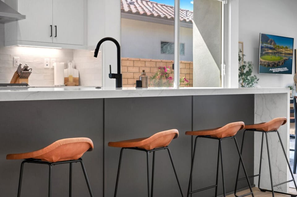Breakfast bar w/ seating & pass-through window for easy indoor-outdoor flow