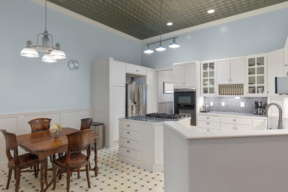 The bbright and open kitchen is fully stocked for all your cooking needs, just bring food!