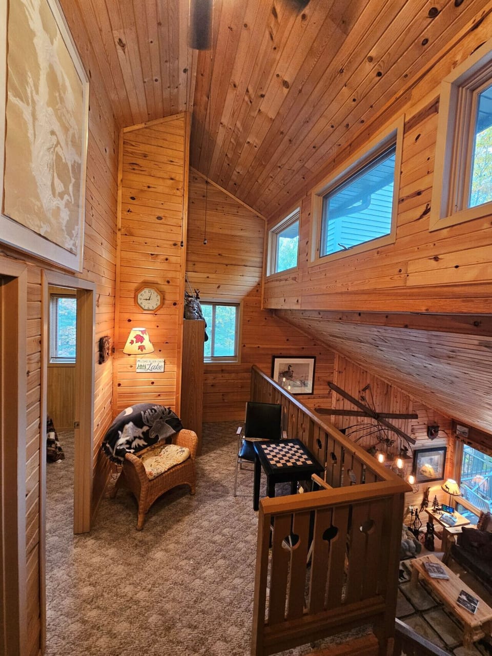 Cozy up in this warm wood loft with soaring ceilings and a reading nook perfect for quiet mountain moments.