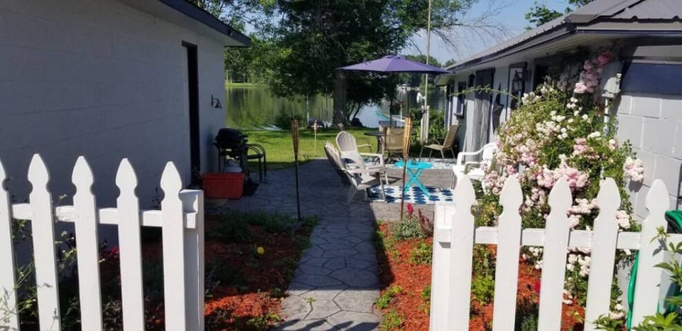 A welcoming walkway and patio greets you upon arrival.