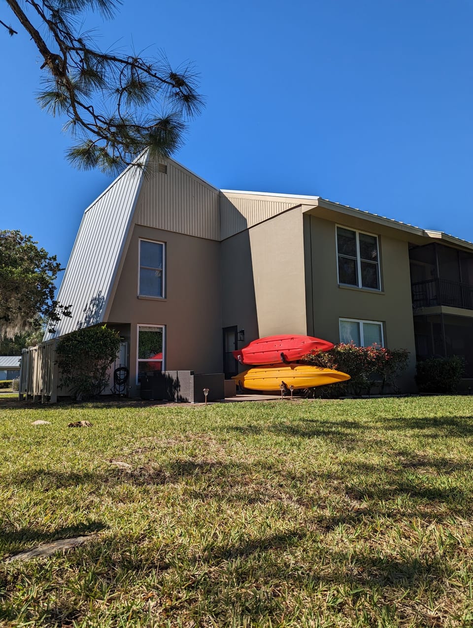 Corner unit with two kayaks ready for adventure! Small propane grill. 