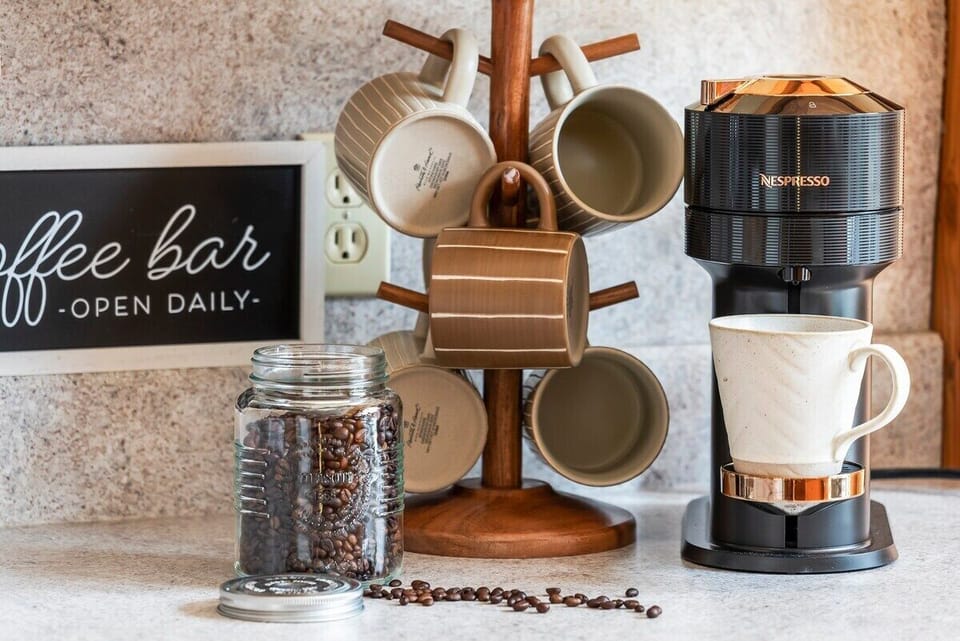 Treat yourself to a delicious coffee with our Nespresso Virtuo Next - a pack of 8 to 10 pods will be provided upon arrival. We also supply coffee beans (pictured), grinder, kettle and 
a French press.