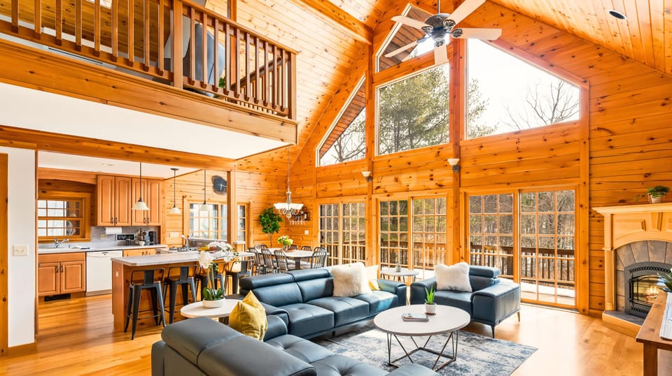 Main living and dining area filled with natural light all day round for all guests to enjoy. Windows open to the outdoor deck