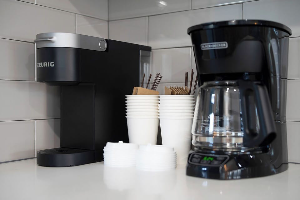 But first..coffee.  Take your pick, K-Cup or Drip, the choice is yours.  Make a cup to go, on us!