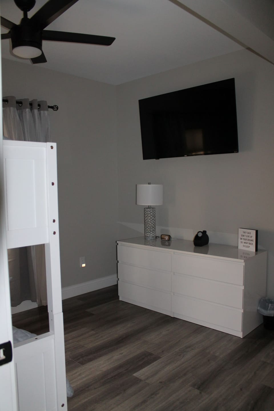 Dresser and 55" Roku tv in bunkroom.