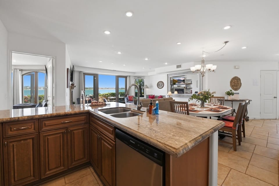 Your gourmet kitchen island with Mission Bay views streaming through every window.