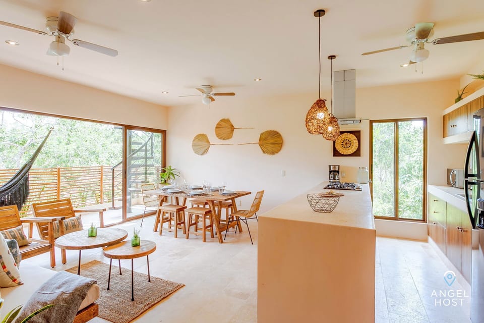 A soothing natural open living space where the living, dining room, and kitchen