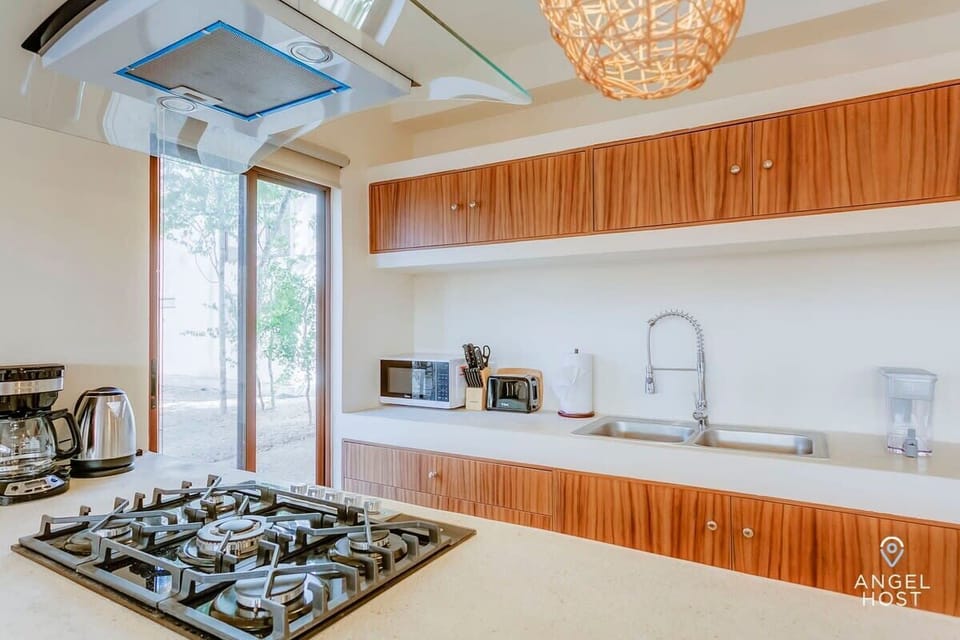 A fully-equipped kitchen with high-end appliances to prepare meals at home