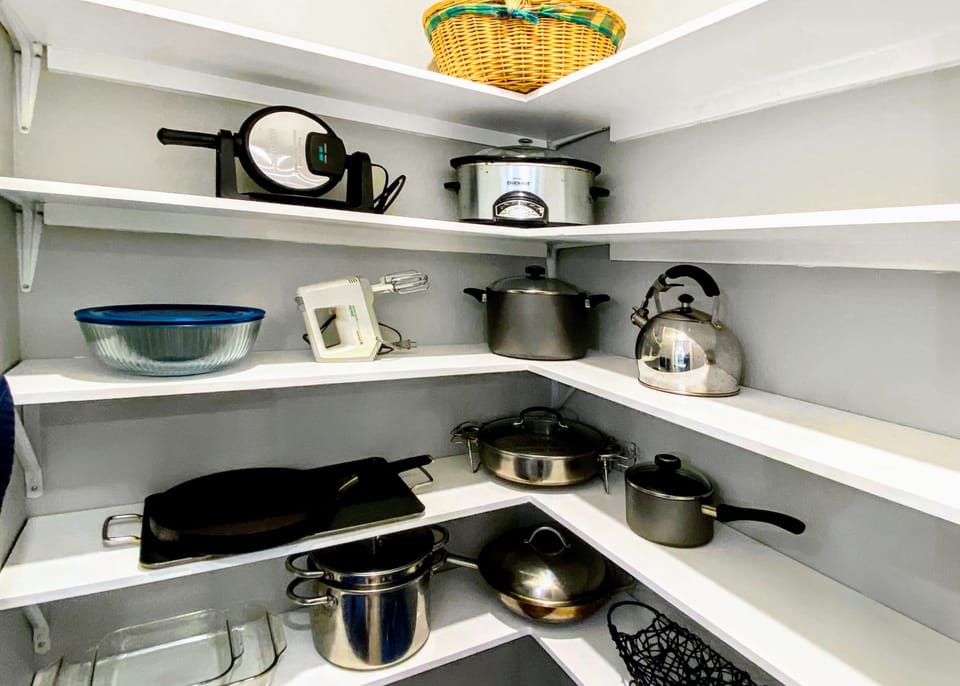The pantry is stocked with all cookware you need to enjoy a home-cooked meaL.