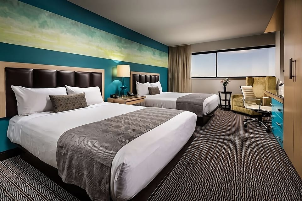 Settle into crisp bedding with space for everyone.