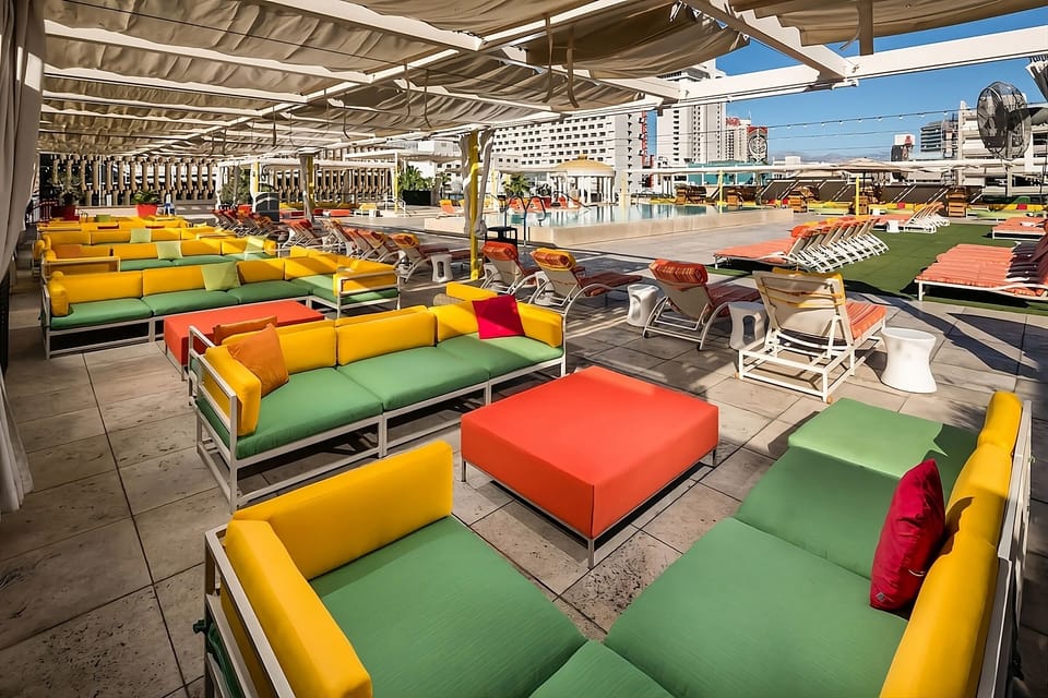 Kick back on the rooftop with colorful couches and skyline views.