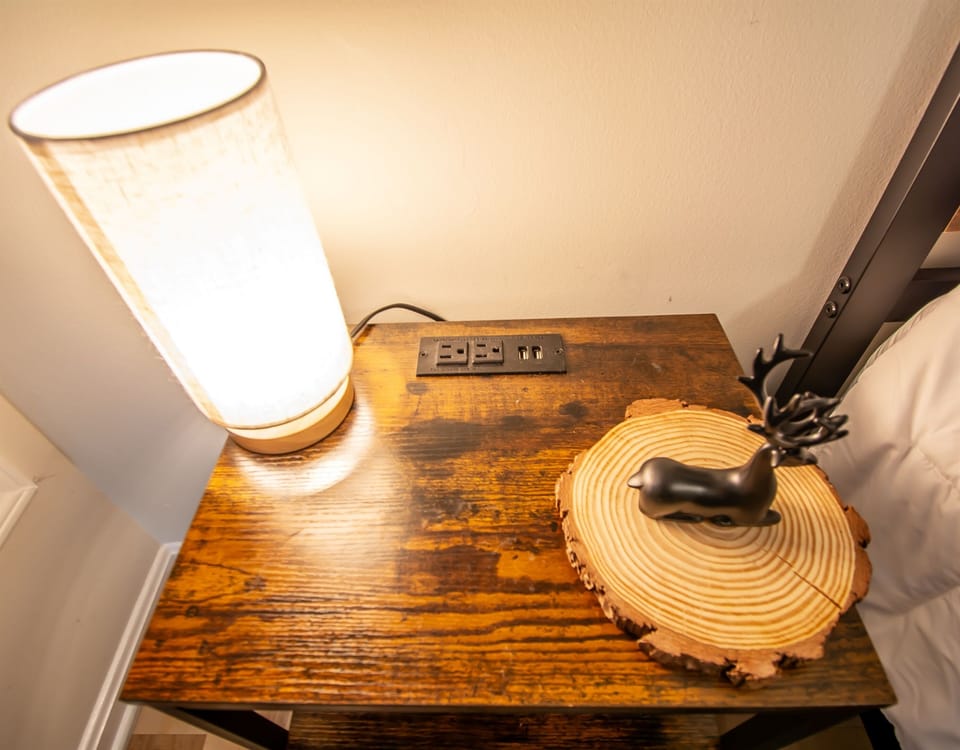 Outlets and/or USB charging stations and lamps provided next to every bed. 