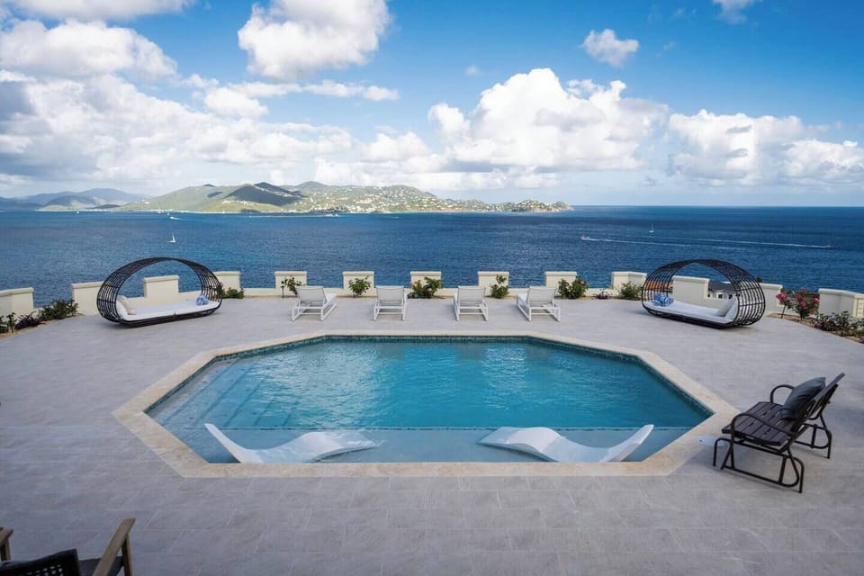 Enjoy our spacious pool area with in pool loungers, chaise lounge chairs, and plush daybeds to fully relax on your vacation!