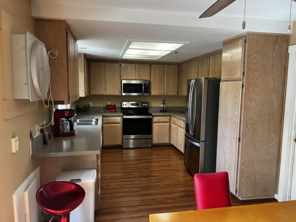 Full Kitchen, oven, dishwasher, modern fridge, coffee makers, dishes, silverware
