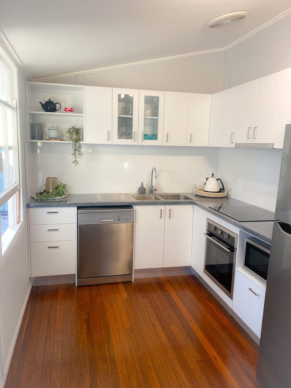 New modern kitchen with dishwasher, fridge, Nespresso machine. 