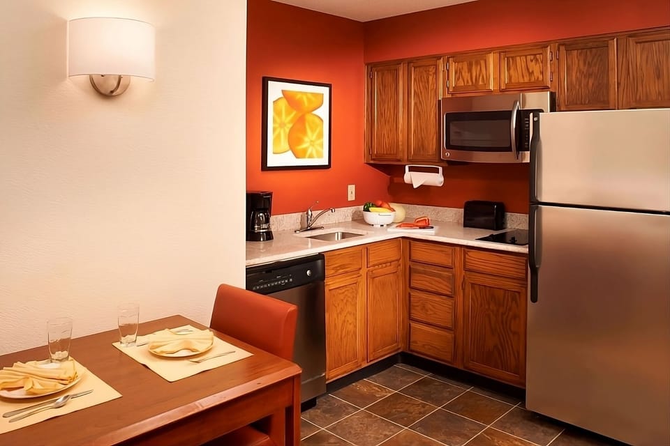 Cook with ease in a tidy kitchenette with modern essentials.