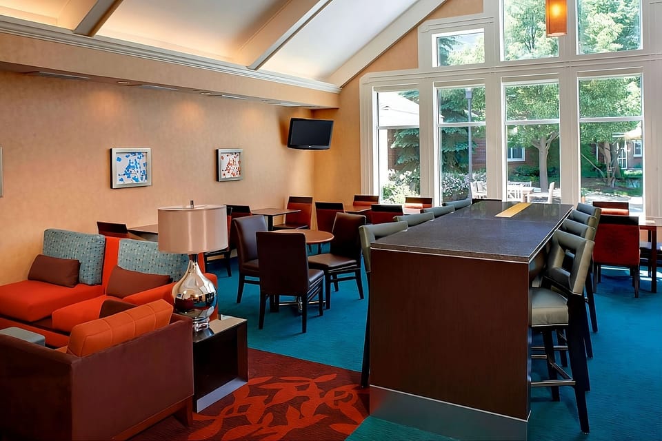 Gather and relax in a stylish lounge with airy garden views.