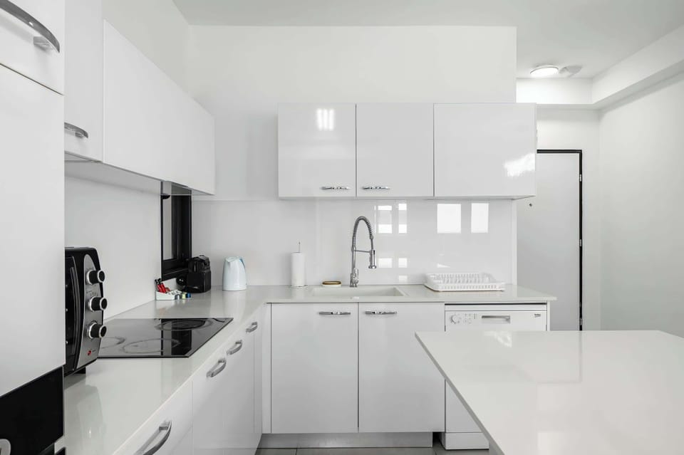 Bright kitchen corner supports easy meal prep, while keeping everything simple, functional, and within reach.