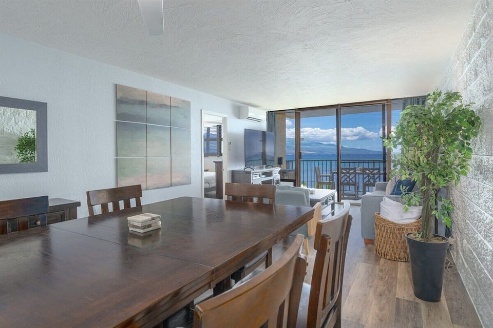 Gather around our spacious dining table with ocean views! Perfect for sharing meals and making memories.
