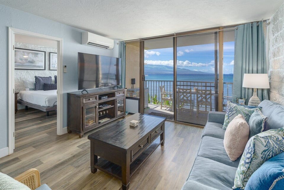Relax in style at Kanai A Nalu 218! Enjoy stunning ocean views from the living room. Your perfect Maui escape awaits!