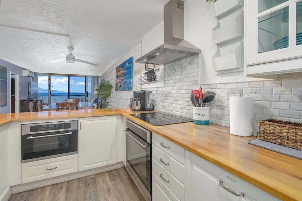 Cook with a view! Our kitchen overlooks the stunning ocean, making meal prep a joy. Book your scenic stay! 