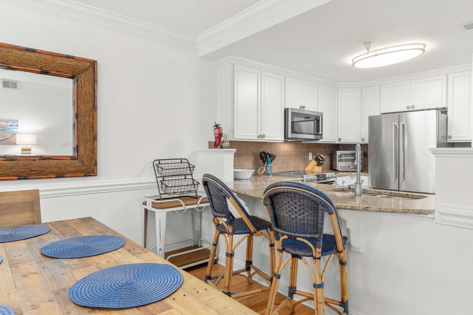 The dining area with seating for 6 and countertop seating for 2
