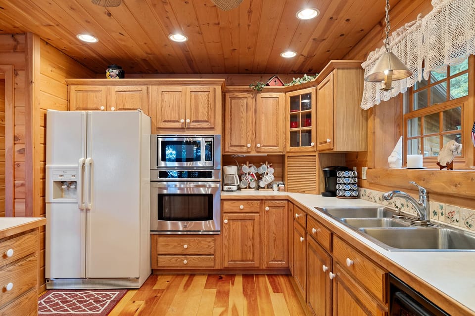 The inviting kitchen is fully equipped to cook delicious meals during your stay.