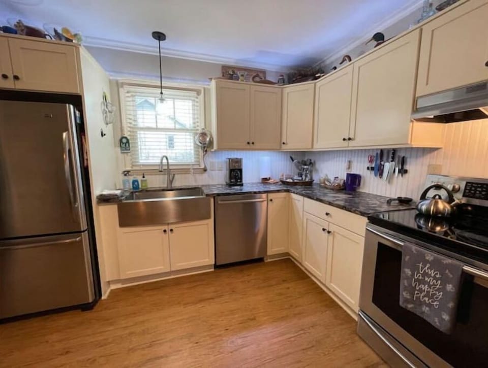 Upgraded kitchen with stainless appliances and leathered granite countertops.