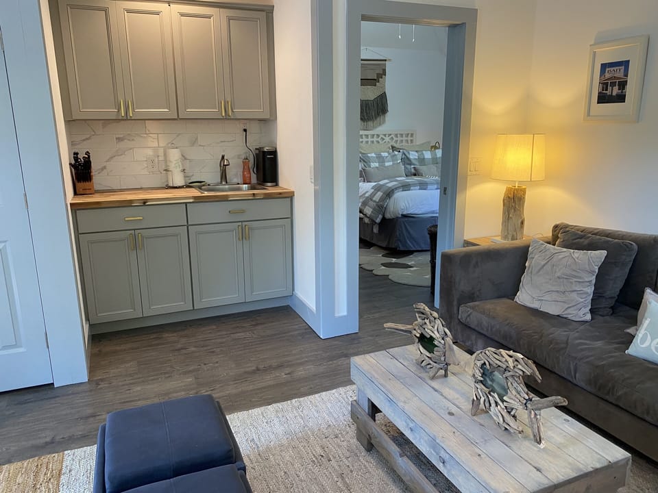 Open Concept Living Room with Fully Stocked Kitchenette-