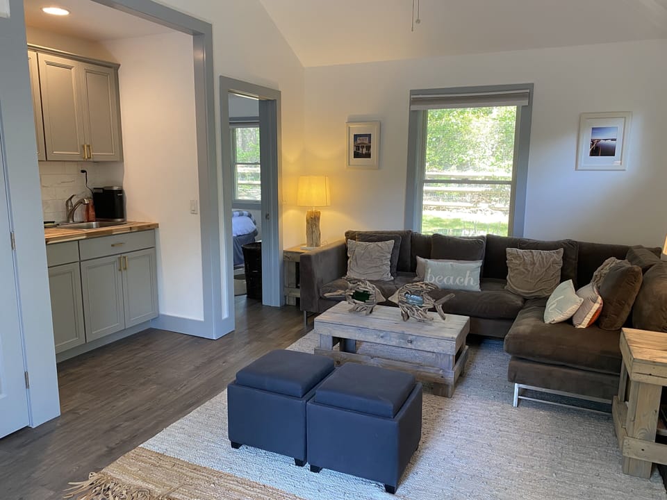 Open Concept Living Room with Fully Stocked Kitchenette-