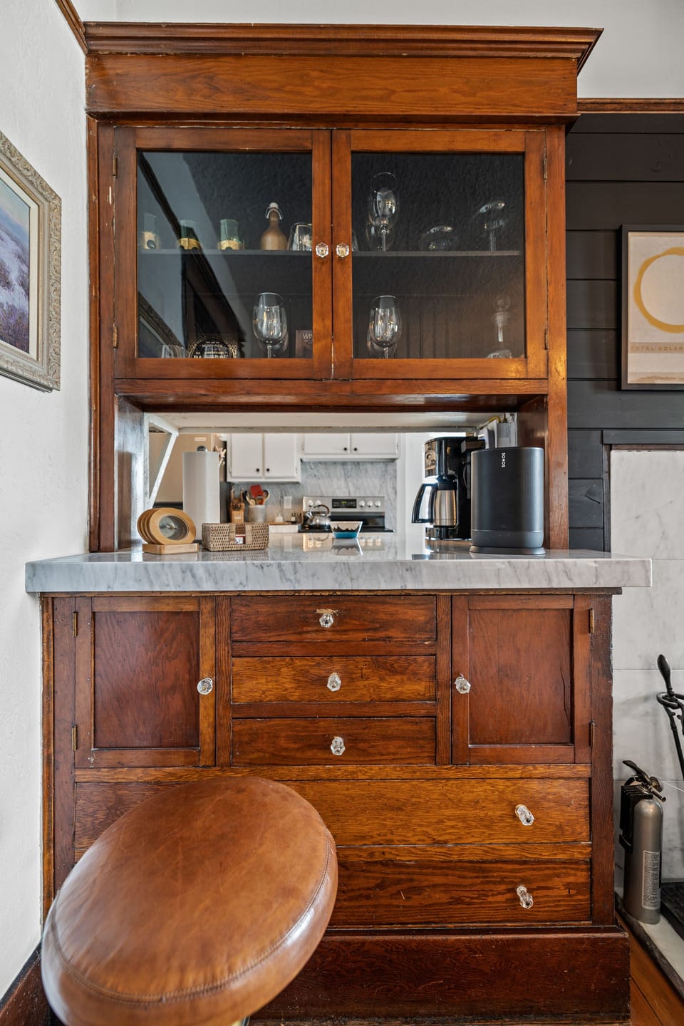 Bar is stocked with glassware, wine opener and stoppers.