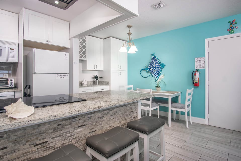 Kitchen and Dining area with breakfast bar and plenty of prep space
