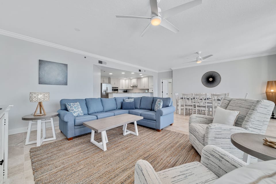 Experience coastal comfort in this beautifully appointed living room. Featuring a sectional pull-out sofa for extra guests and direct access to your private balcony overlooking the serene waters.