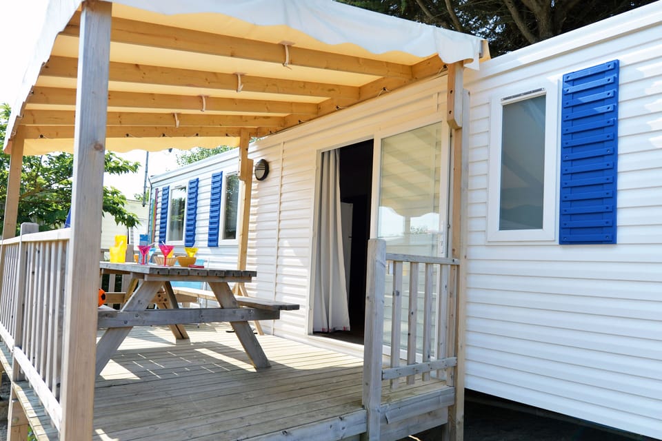 Step outside to this charming deck area, perfect for morning coffee or al fresco meals in the open air.