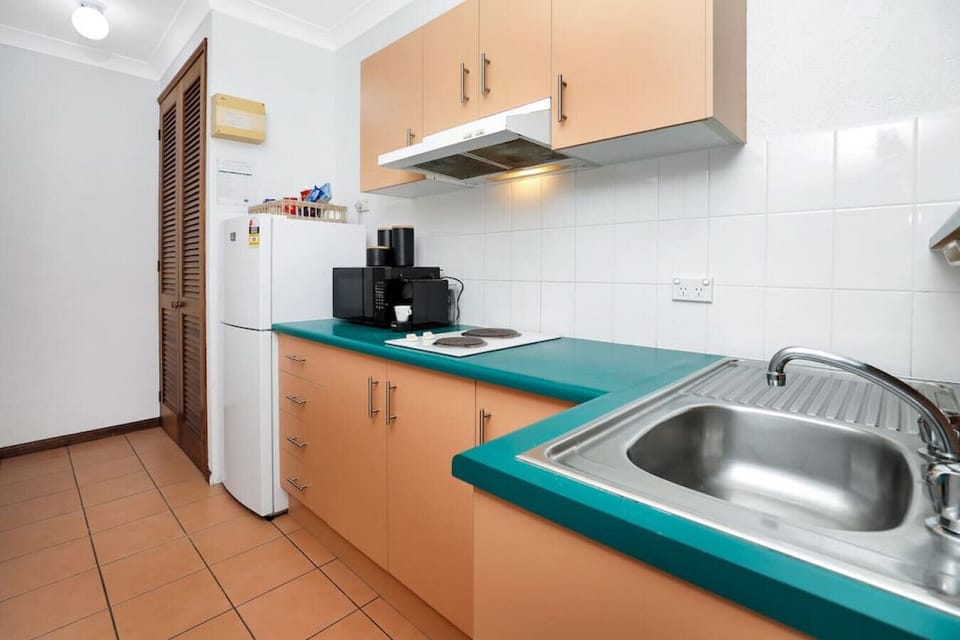 Kitchen with cooktop, microwave, Nespresso machine