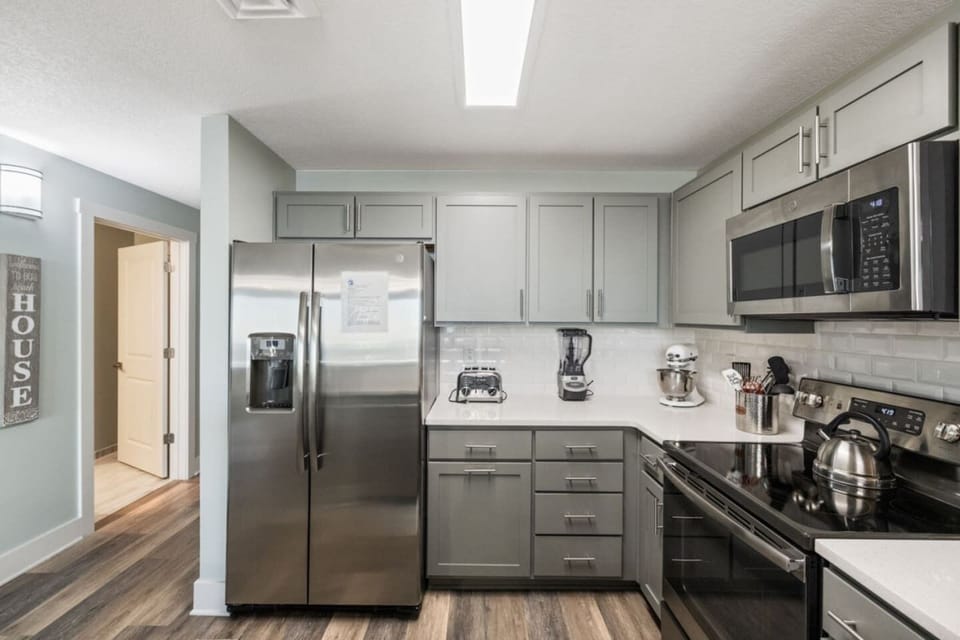 Kitchen is loaded with a airfryer/ toaster oven , dishwaher, oven and microwave and wine fridge
