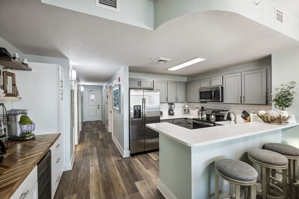 Kitchen is loaded with a airfryer/ toaster oven , dishwaher, oven and microwave and wine fridge