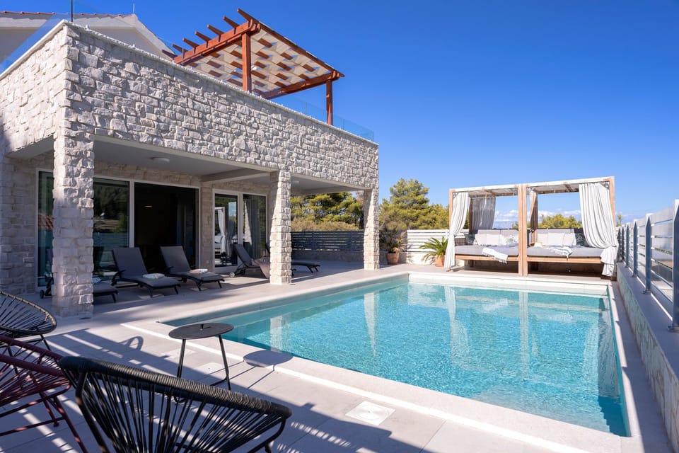Villa Belpur | Pool area, the balcony and the canopy bed